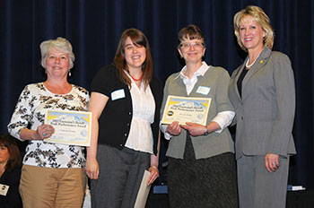 Photo of the employees of the Alaska State Library Talking Book Center receiving award