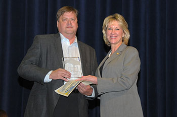 Photo of Rory Redick receiving the Co-Worker Regognition Award