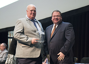 Photo of Ron Josephson receiving Leadership award
