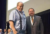 Photo of _______ accepting Exceptional Performance Honorable Mention on behalf of Tom Straugh